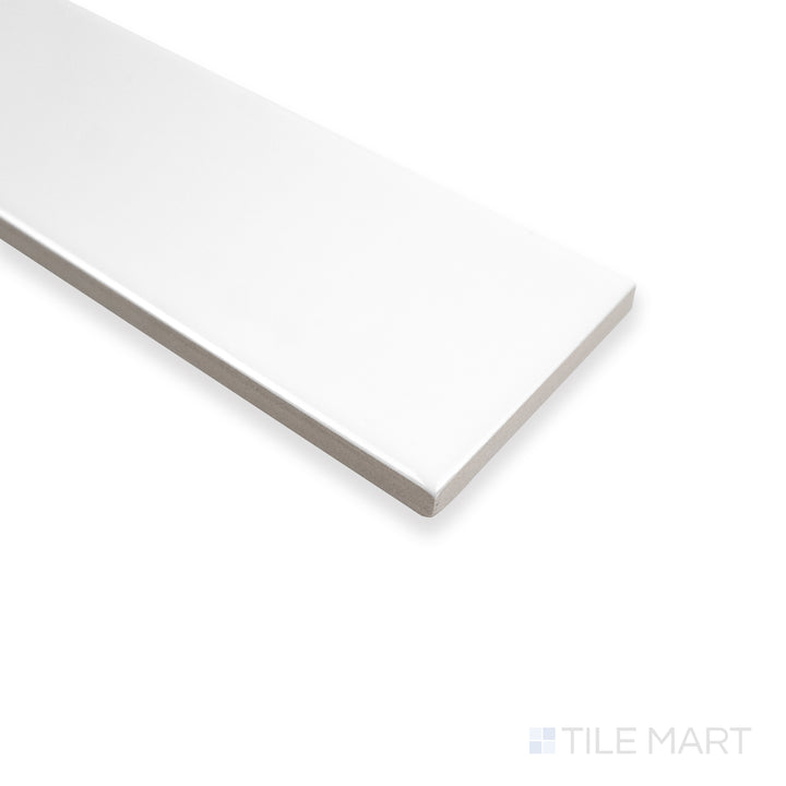 Corner shot of Block Blanco 2X10 bright ceramic tile, showcasing its pristine white surface, glossy finish, and crisp edge alignment.