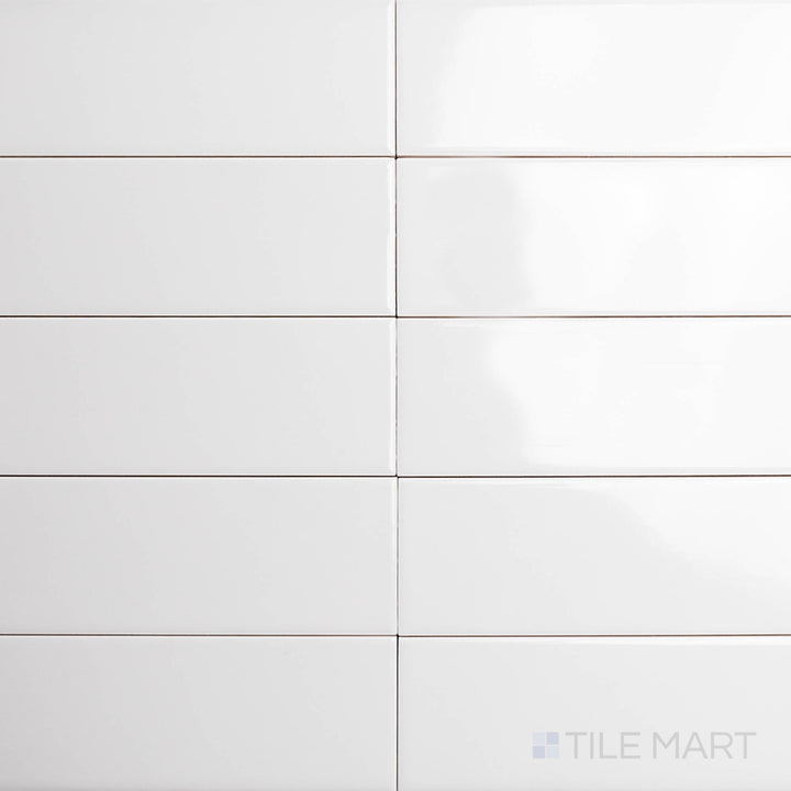 A top-down perspective of the Block Gris 2x10 inch bright ceramic tile showcases its elegant gray hue with a polished glaze, offering a refined and timeless appeal.