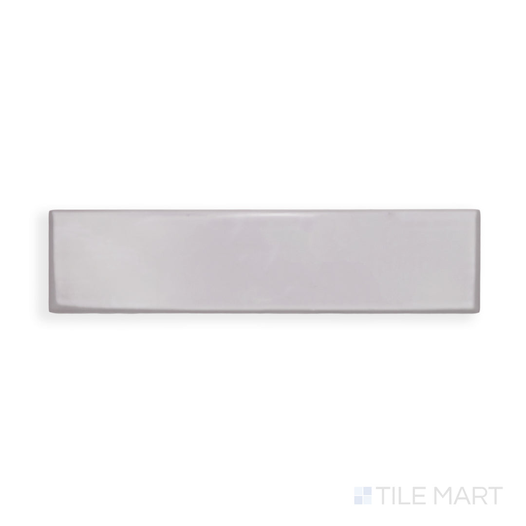 An intricate view of Block Acero 2X10 Bright Ceramic reveals its cool steel-inspired shade and high-gloss sheen, ideal for industrial and modern aesthetics.