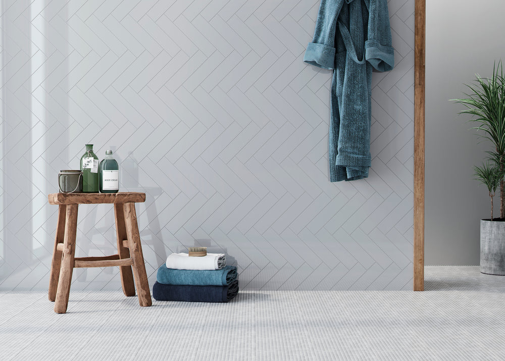 A sleek and stylish wall design using Block Acero 2x10 bright ceramic tiles. The glossy surface reflects light beautifully, creating a fresh and modern ambiance in kitchens or bathrooms.