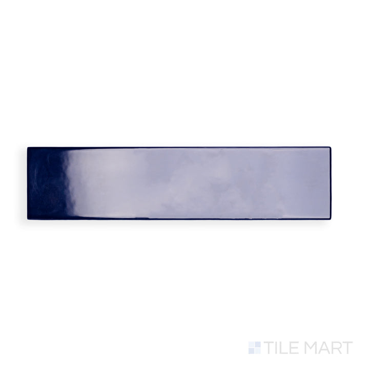 A high-resolution close-up of Block Azul 2X10 Bright Ceramic captures its vibrant blue color and reflective surface, bringing a bold accent to walls and backsplashes.