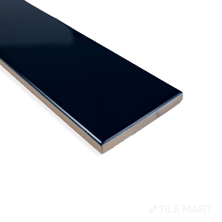 Close-up corner view of Block Azul 2X10 bright ceramic tile, featuring its striking blue hue, polished shine, and seamless corner transition.