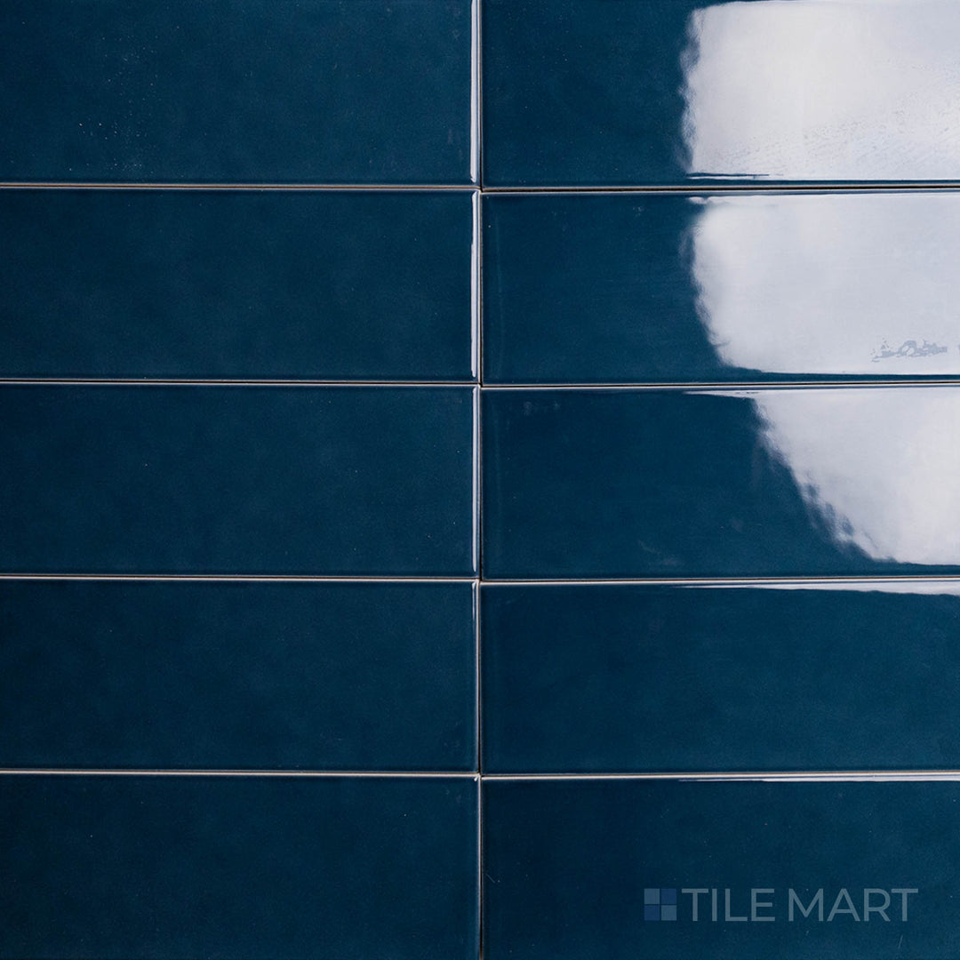 A top-down view of the Block Verde 2x10 inch bright ceramic tile highlights its rich green hue and glossy surface, perfect for adding a natural and refreshing touch to interiors.