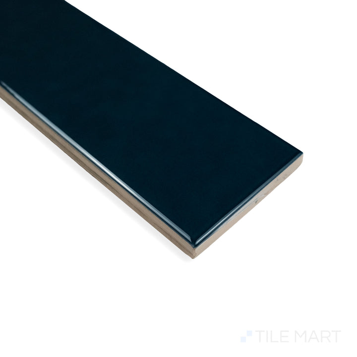 Angled corner perspective of Block Verde 2X10 bright ceramic tile, displaying its fresh green color, glossy surface, and perfectly aligned edges.