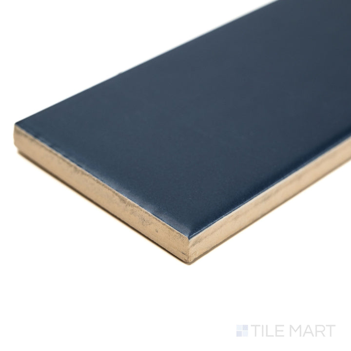 Corner image of Block Azul 2x10 matte ceramic tile in bold blue, showing its full edge detail and soft matte glaze—suited for accent walls or kitchen backsplashes.