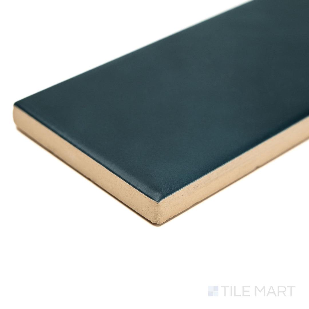 Block Verde 2x10 matte ceramic tile captured from the corner, emphasizing its earthy green tone, matte texture, and clean lines—great for stylish bathroom or feature wall settings.