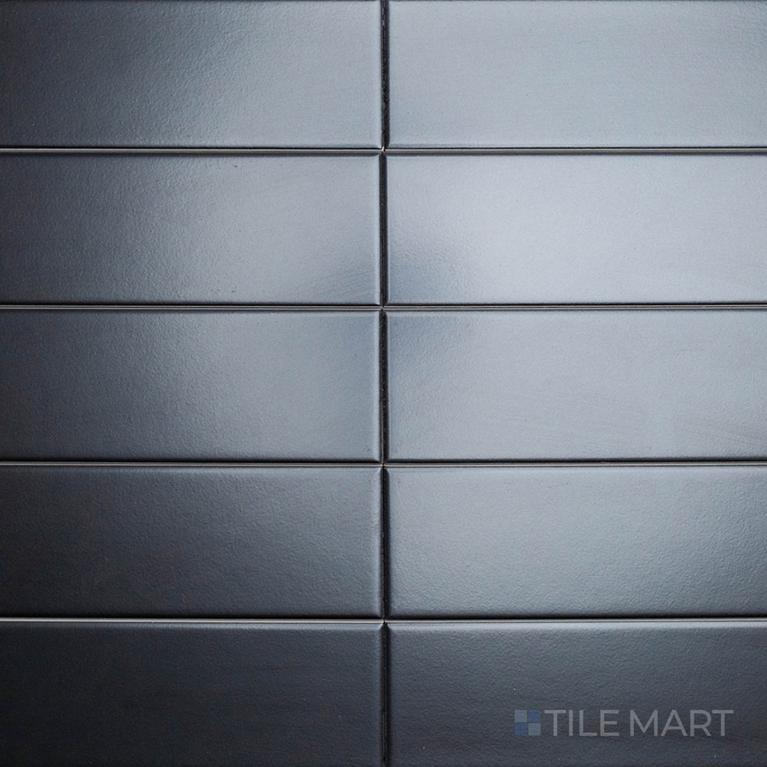 An overhead view of the Block Negro 2x10 inch matte ceramic tile captures its deep black tone and velvety texture, offering a bold yet understated design element.