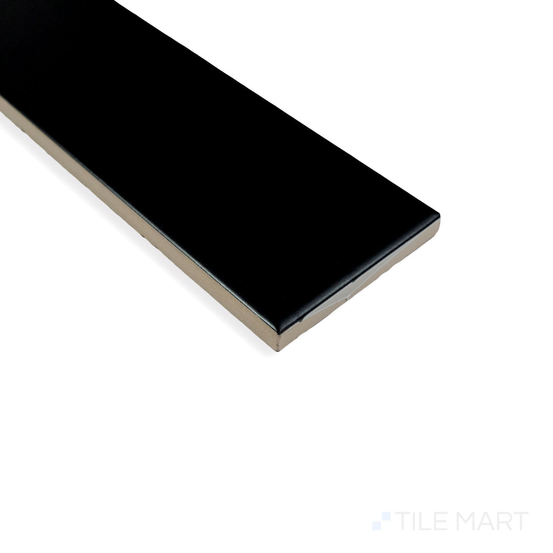Corner shot of Block Negro 2X10 matte ceramic tile, highlighting its deep black color, soft matte texture, and well-structured corner alignment.