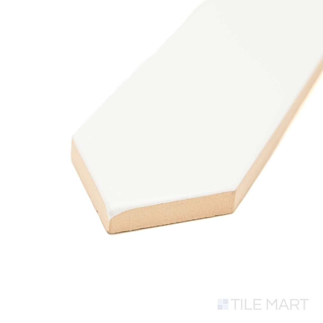 Corner view of Block Blanco 2x10 Arrow Bright ceramic tile with a glossy white finish and textured arrow pattern—an eye-catching option for decorative walls and backsplash designs.