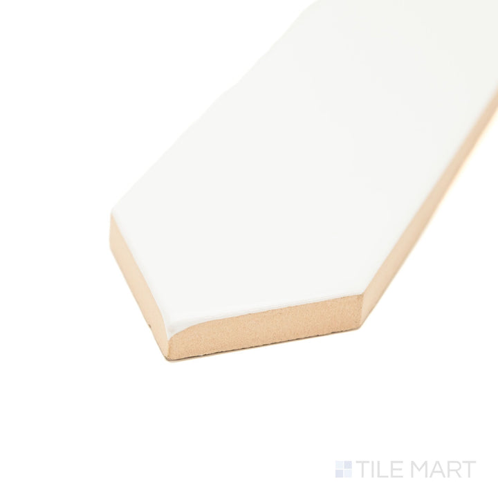 Corner view of Block Blanco 2x10 Arrow Bright ceramic tile with a glossy white finish and textured arrow pattern—an eye-catching option for decorative walls and backsplash designs.