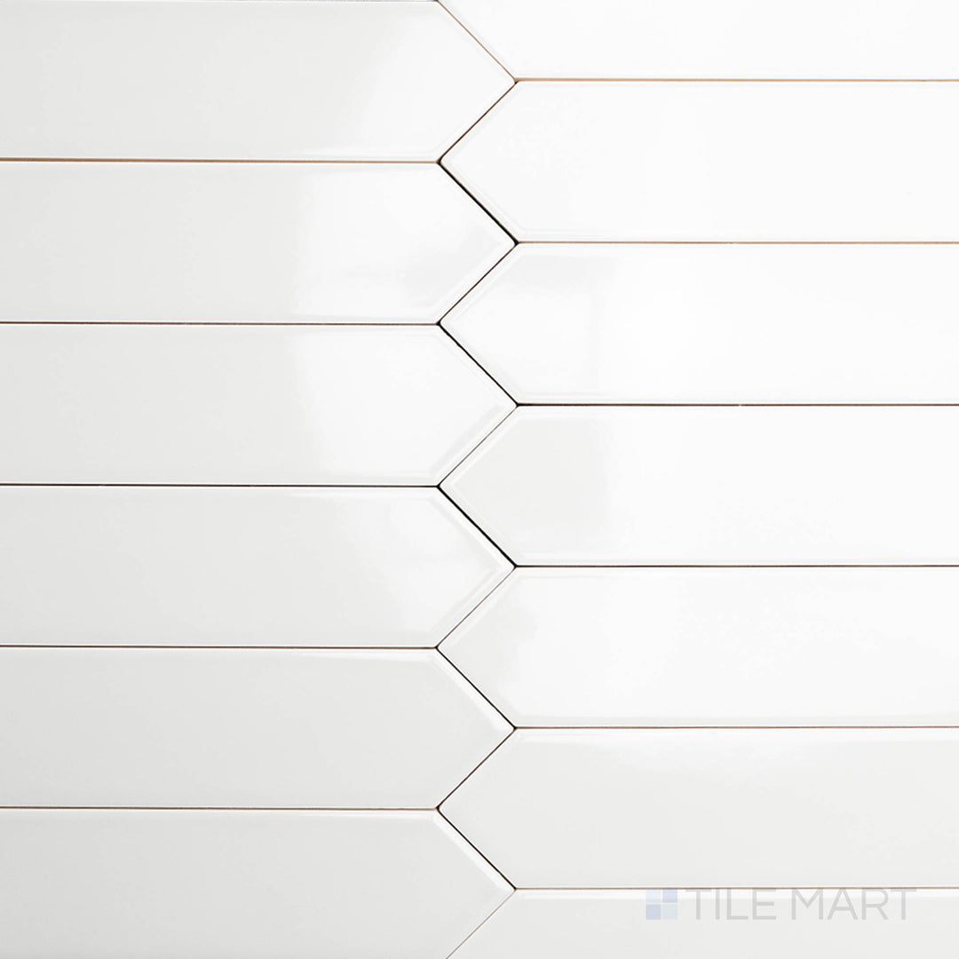 This bird’s-eye shot of the Block Gris 2x10 inch Arrow bright ceramic tile showcases its elegant gray shade with a glossy finish, arranged in a dynamic arrow pattern.