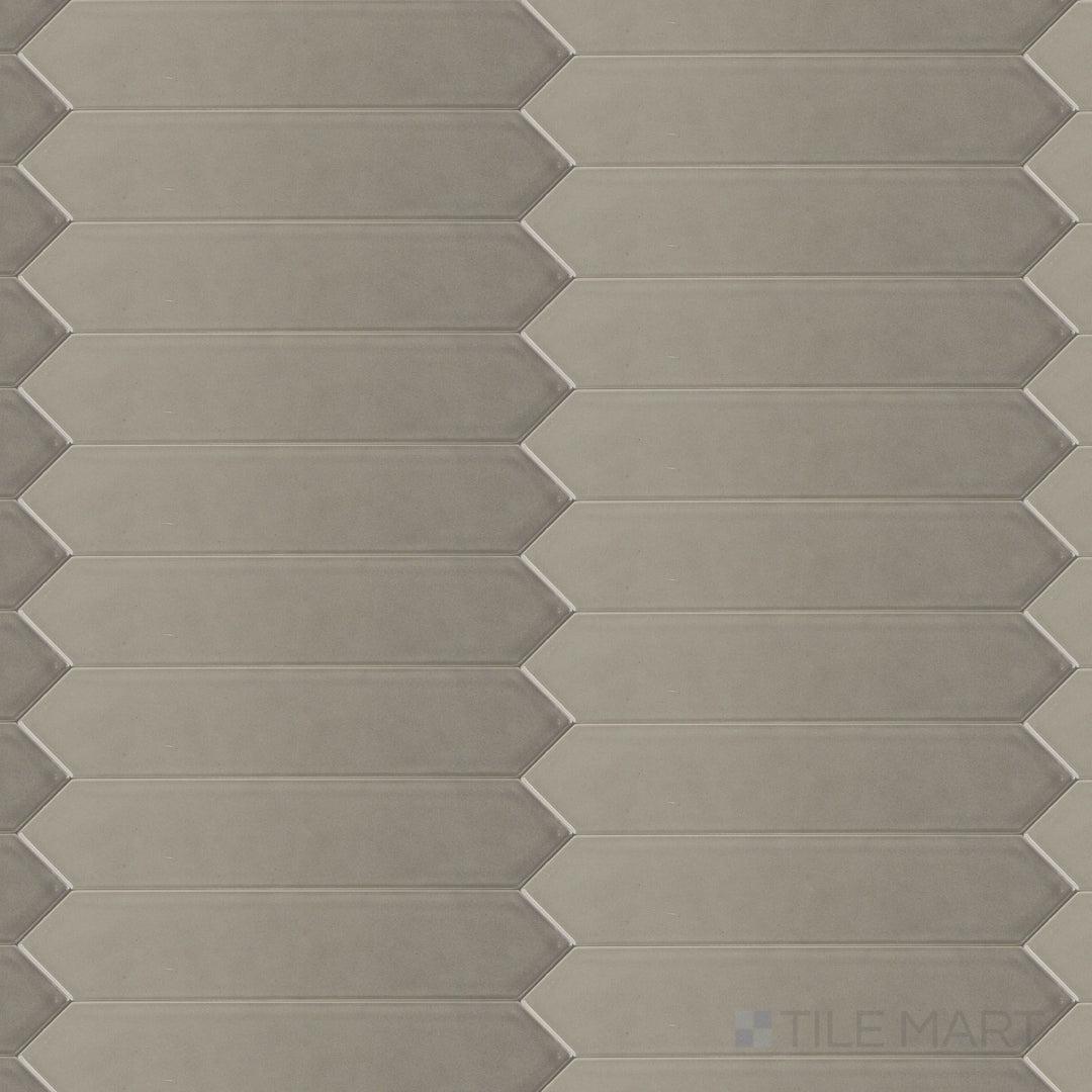 Block Acero 2x10 Arrow Bright ceramic tile in a bright steel gray shade, displayed in overview to highlight its high-shine finish and geometric arrow texture.