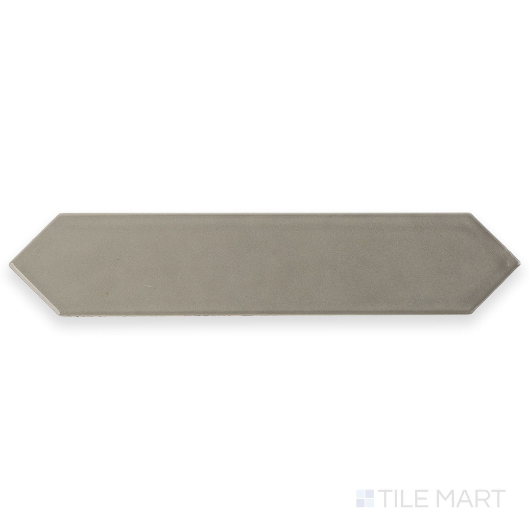This full tile shot highlights the Block Acero 2x10 Arrow Bright ceramic tile in sleek gray, featuring a glossy finish and defined arrow pattern.