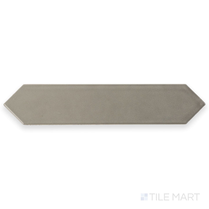 This full tile shot highlights the Block Acero 2x10 Arrow Bright ceramic tile in sleek gray, featuring a glossy finish and defined arrow pattern.