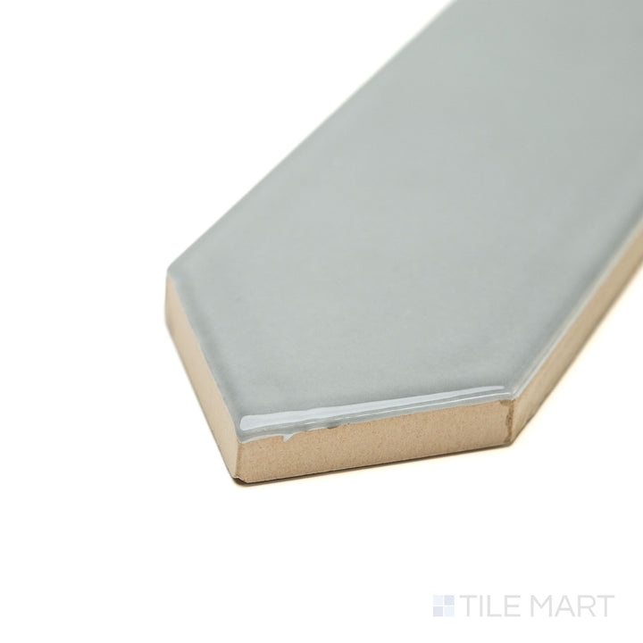 Corner angle of Block Acero 2x10 Arrow Bright ceramic tile in sleek gray, highlighting its glossy finish and linear arrow texture—ideal for contemporary kitchen or shower walls.