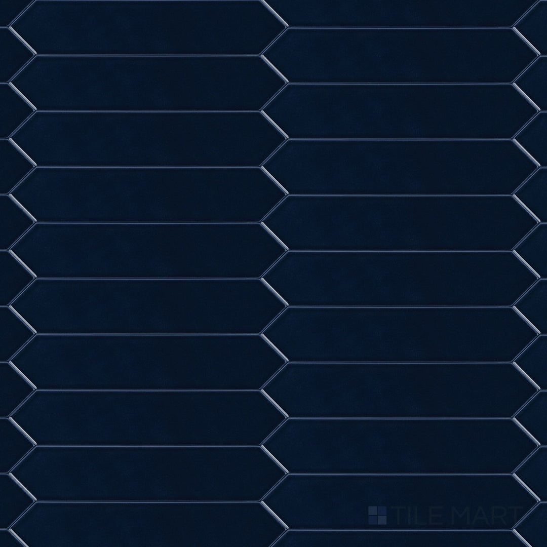 Overview of Block Azul 2x10 Arrow Bright ceramic tile in vibrant blue with a glossy surface and distinctive arrow pattern, perfect for bold design statements.