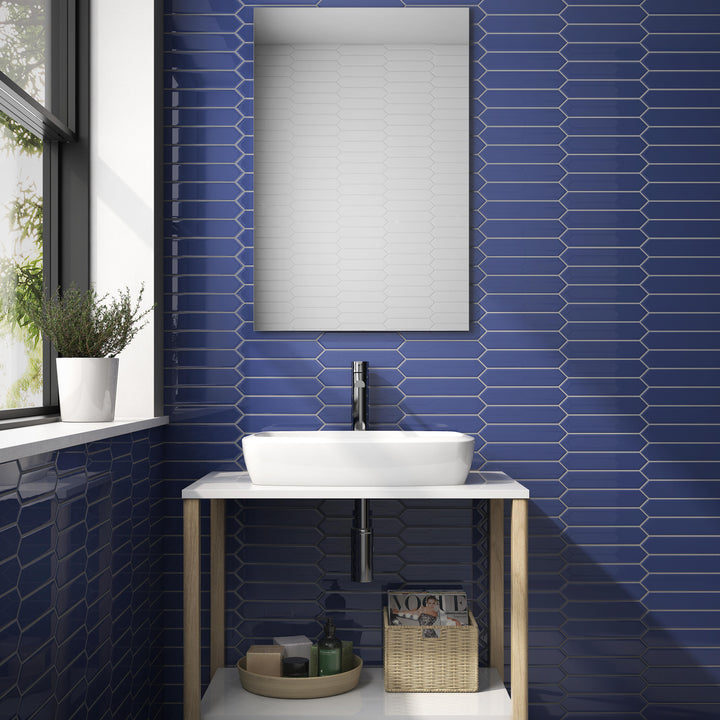 Lifestyle view of Block Azul 2x10 Arrow Bright ceramic tile, showing off its bold blue color, glossy finish, and geometric texture in a real-world environment.