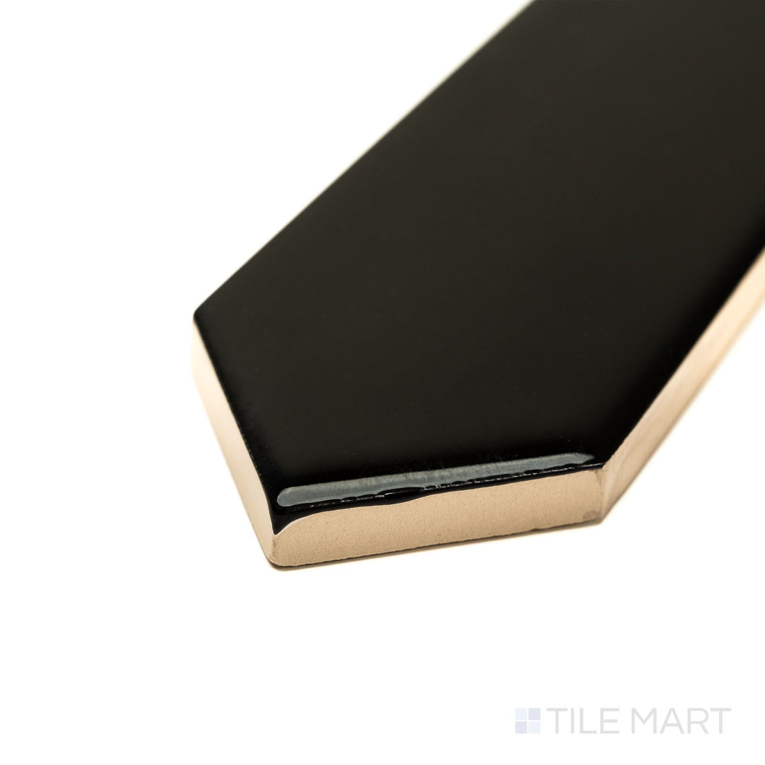 Corner perspective of Block Negro 2x10 Arrow Bright ceramic tile, showcasing a bold black finish with a glossy texture and sharp arrow motif—great for dramatic wall accents.