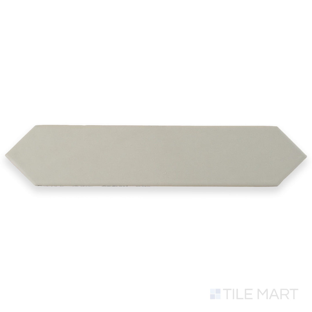 Seen from above, this Block Gris 2x10 Arrow Matte ceramic tile features a soft gray hue with a textured arrow pattern and matte finish.