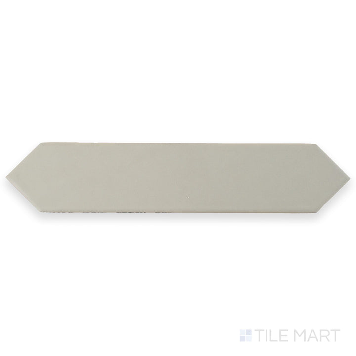 Seen from above, this Block Gris 2x10 Arrow Matte ceramic tile features a soft gray hue with a textured arrow pattern and matte finish.