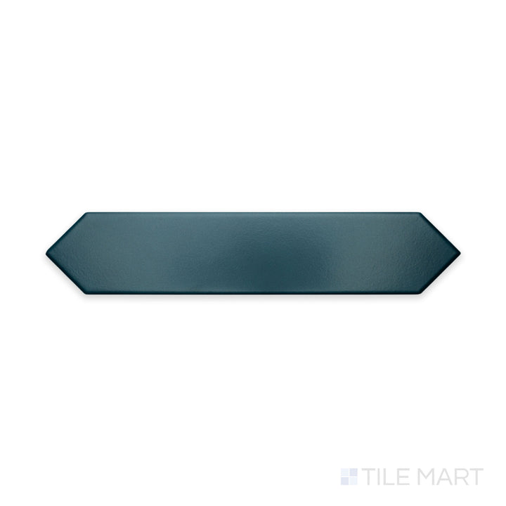 A focused close-up of Block Verde 2X10 Arrow Matte Ceramic highlights its earthy green shade with a unique arrow pattern, ideal for dynamic wall designs.