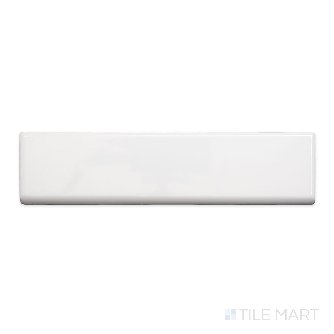 A flat-lay shot of Block Blanco 2x10 bright ceramic bullnose, highlighting its crisp white color and smooth, polished surface.