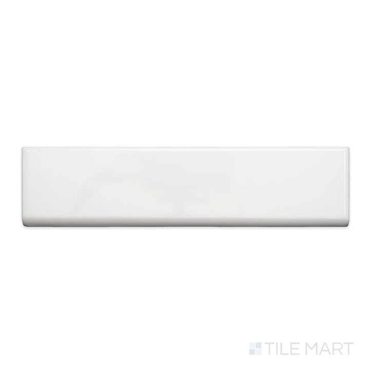 A flat-lay shot of Block Blanco 2x10 bright ceramic bullnose, highlighting its crisp white color and smooth, polished surface.