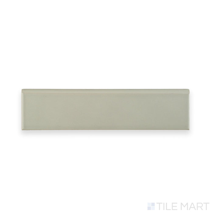 Captured from a top angle, the Block Gris 2x10 Matte Ceramic Bullnose tile highlights its smooth bullnose edge and soft matte gray finish.