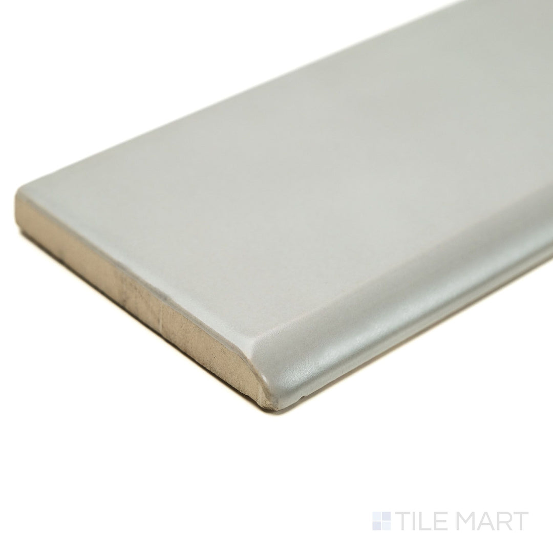 Corner view of Block Acero 2x10 Matte Ceramic Bullnose tile in contemporary gray, highlighting the rounded bullnose edge and matte ceramic finish for seamless wall transitions.