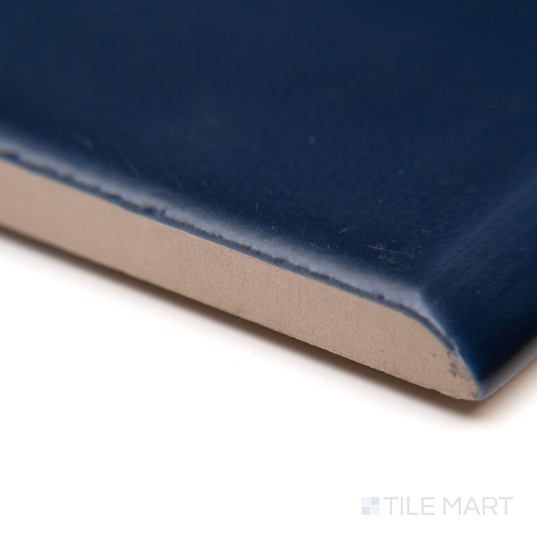 A close-up corner perspective of Block Azul 2x10 matte ceramic bullnose, capturing its bold blue hue with a refined, non-reflective finish.