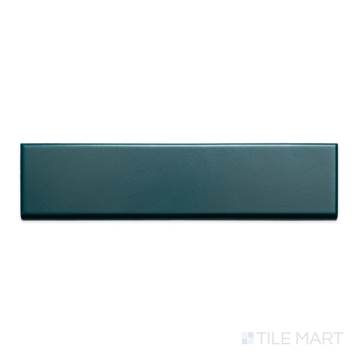 A detailed top-down view of Block Verde 2x10 matte ceramic bullnose, emphasizing its rich green hue and subtle matte surface.