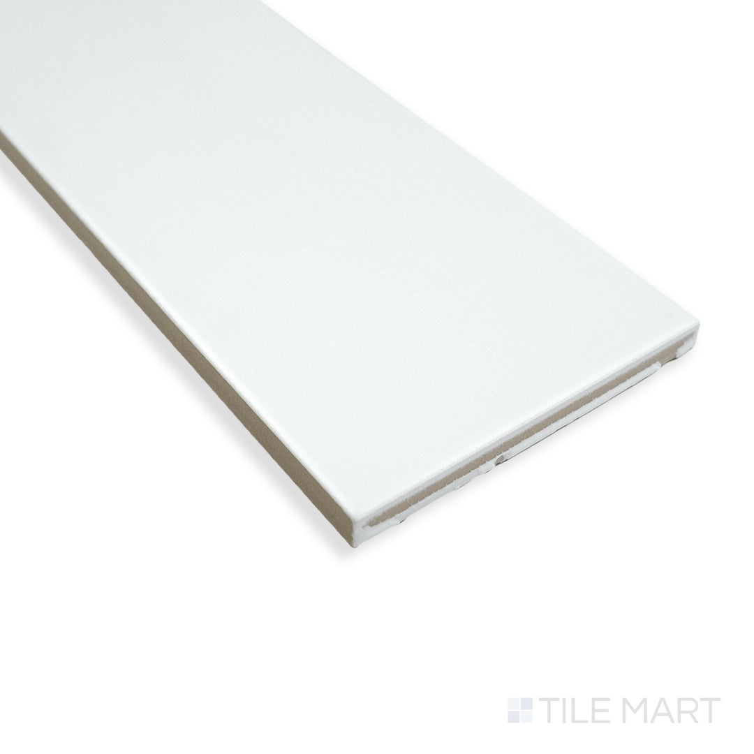 Corner shot of Block Blanco 4X24 matte glazed porcelain tile, featuring its classic white finish, smooth matte texture, and a seamless transition at the tile’s edge.