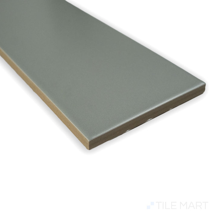 Corner view of Block Acero 4X24 matte glazed porcelain tile, emphasizing its steel-gray shade, refined matte surface, and crisp edge junction.