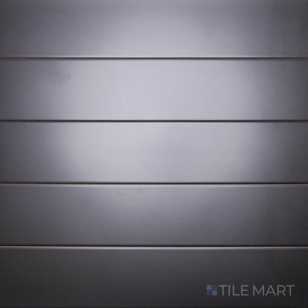 A bird’s-eye perspective of the Block Negro 4x24 inch matte glazed porcelain tile emphasizes its bold black tone and velvety matte surface, ideal for creating a dramatic statement.