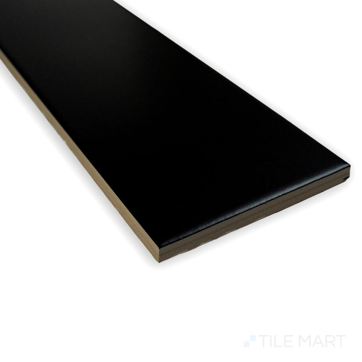 Angled perspective of Block Negro 4X24 matte glazed porcelain tile, showcasing its bold black color, non-reflective matte glaze, and crisp tile junction.