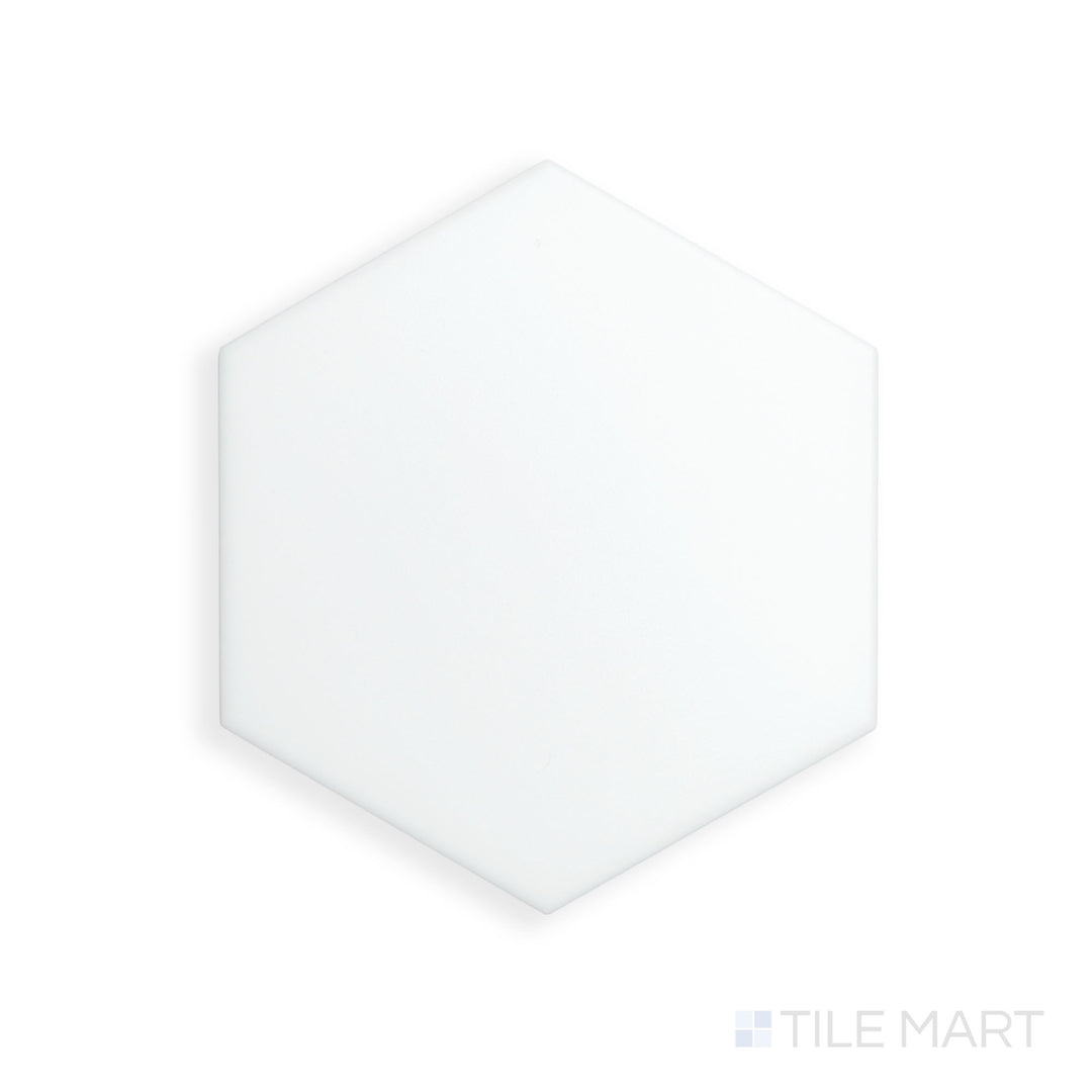 A detailed macro shot of Block Blanco 6" Hexagon Matte Glazed Porcelain showcases its geometric shape and crisp white matte finish, perfect for minimalist designs.