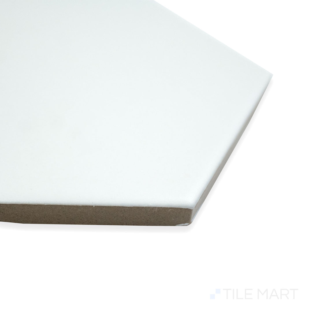 Corner shot of Block Blanco 6" hexagon matte glazed porcelain tile, featuring a crisp white surface, non-glossy finish, and structured hexagonal transition.