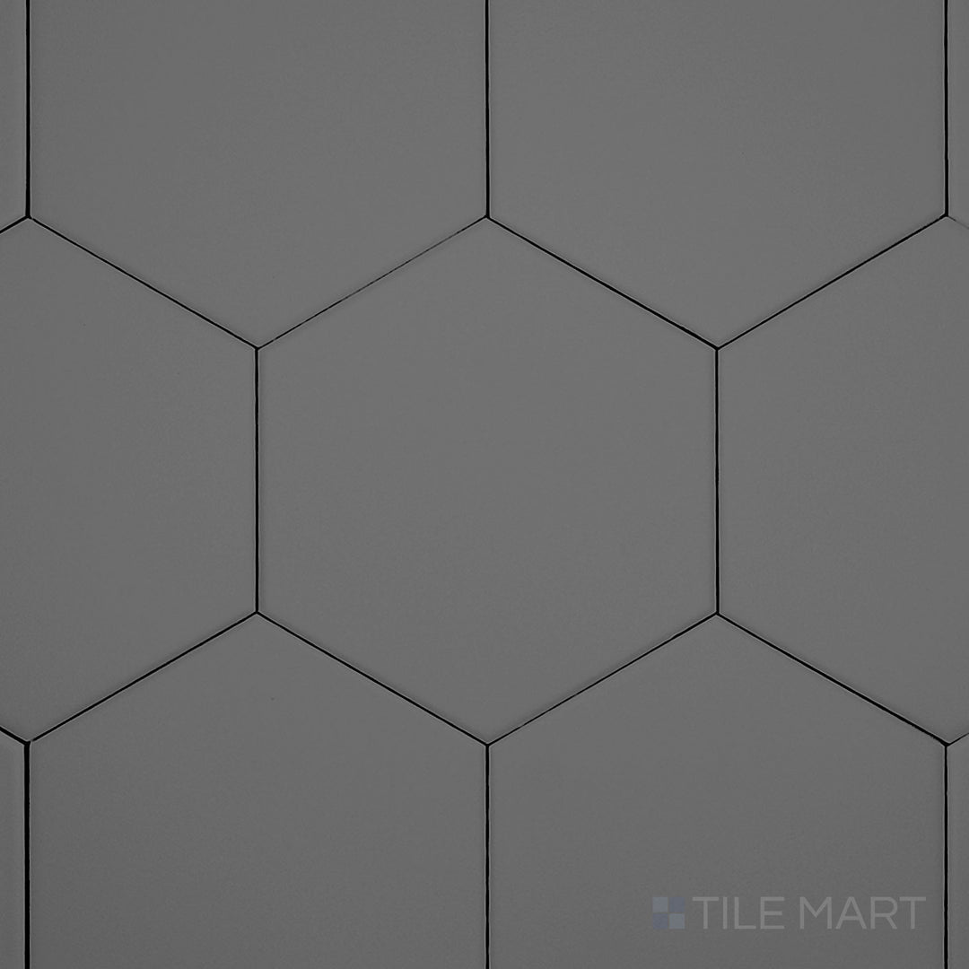 Captured from a high angle, the Block Acero 6-inch hexagon matte glazed porcelain tile showcases its refined steel-gray shade and matte texture, perfect for modern patterns.