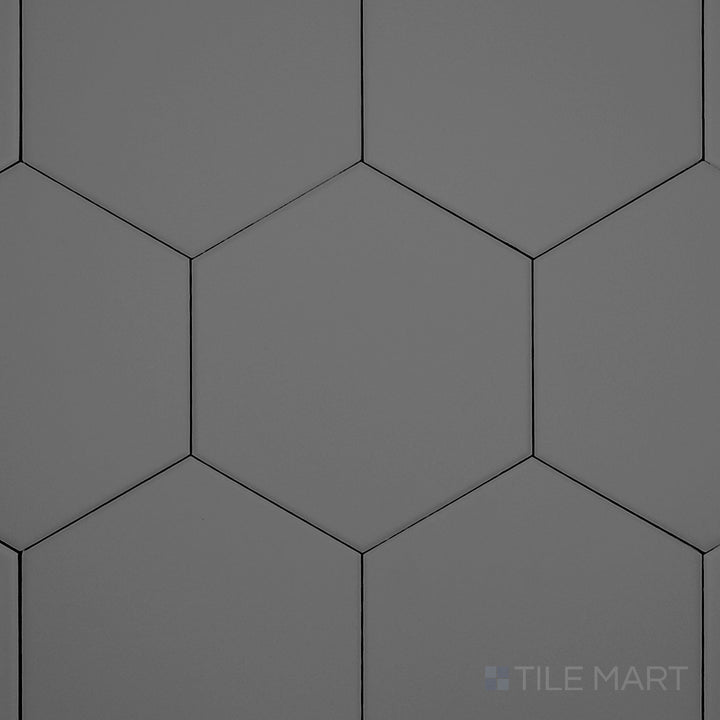 Captured from a high angle, the Block Acero 6-inch hexagon matte glazed porcelain tile showcases its refined steel-gray shade and matte texture, perfect for modern patterns.
