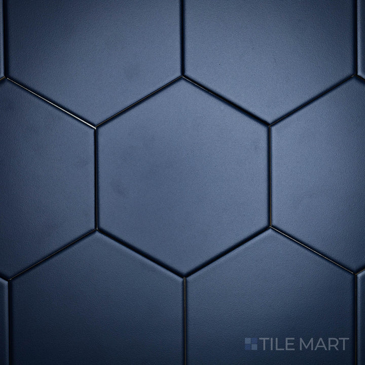 A top-down shot of the Block Azul 6-inch hexagon matte glazed porcelain tile highlights its rich blue shade and matte finish, adding depth and vibrancy to geometric designs.