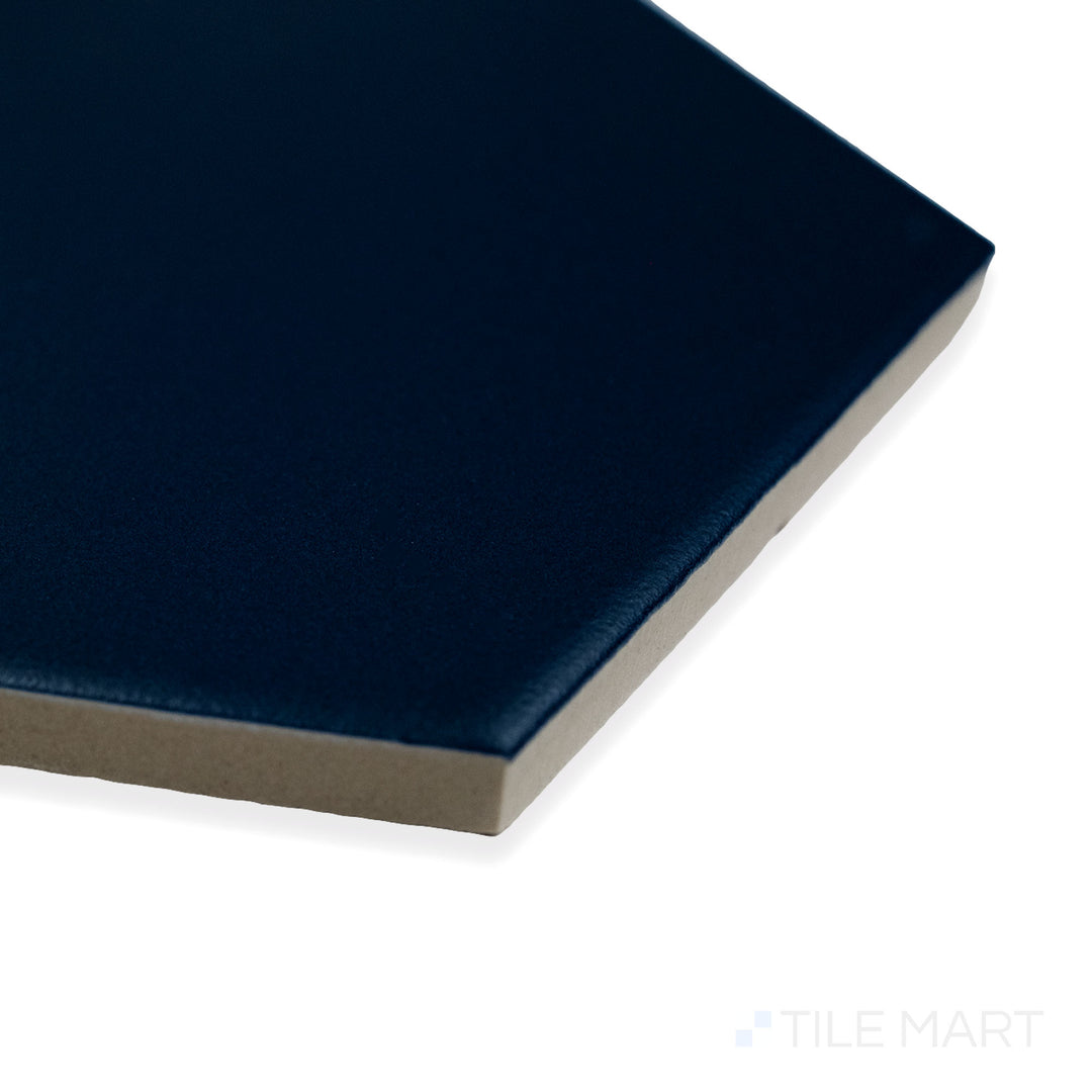 Corner-focused image of Block Azul 6" hexagon matte glazed porcelain tile, displaying its bold blue hue, smooth matte texture, and structured hexagonal transition.
