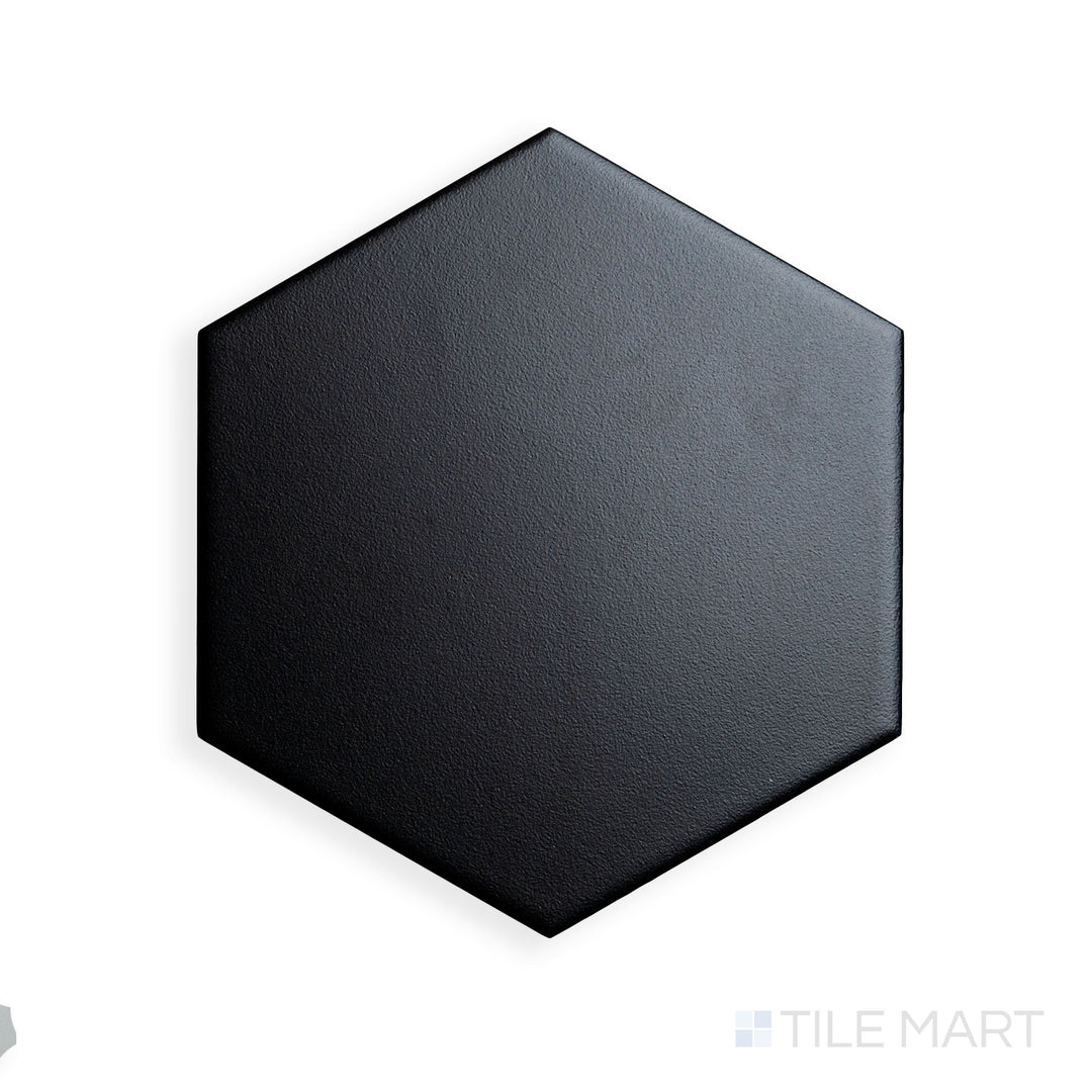 A focused shot of Block Negro 6" Hexagon Matte Glazed Porcelain highlights its deep black shade and geometric precision, offering a bold design statement.