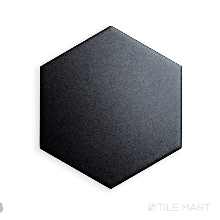 A focused shot of Block Negro 6" Hexagon Matte Glazed Porcelain highlights its deep black shade and geometric precision, offering a bold design statement.