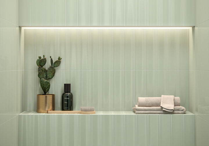 Infuse your space with a soothing touch of nature using CC Cosmos Sage Green 3X12 bright ceramic tile, a refreshing blend of tranquility and modern design.