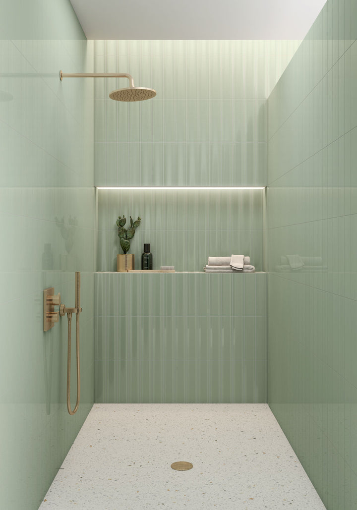 A rich sage green color and a bright ceramic finish bring a fresh, organic feel to Cc Cosmos Sage Green 3x12 tile.