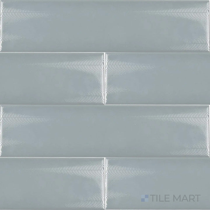 A bird’s-eye view of the Cc Cosmos Mist 3x12 inch bright ceramic tile captures its light grayish-blue shade with a glossy finish, perfect for adding a soft and airy aesthetic.