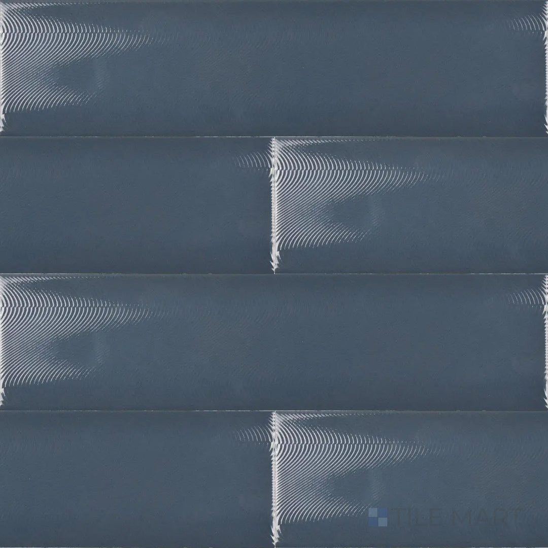 This top-down perspective of the Cc Cosmos Petrol 3x12 inch bright ceramic tile showcases its deep blue-green shade with a smooth, reflective glaze, adding richness and depth.