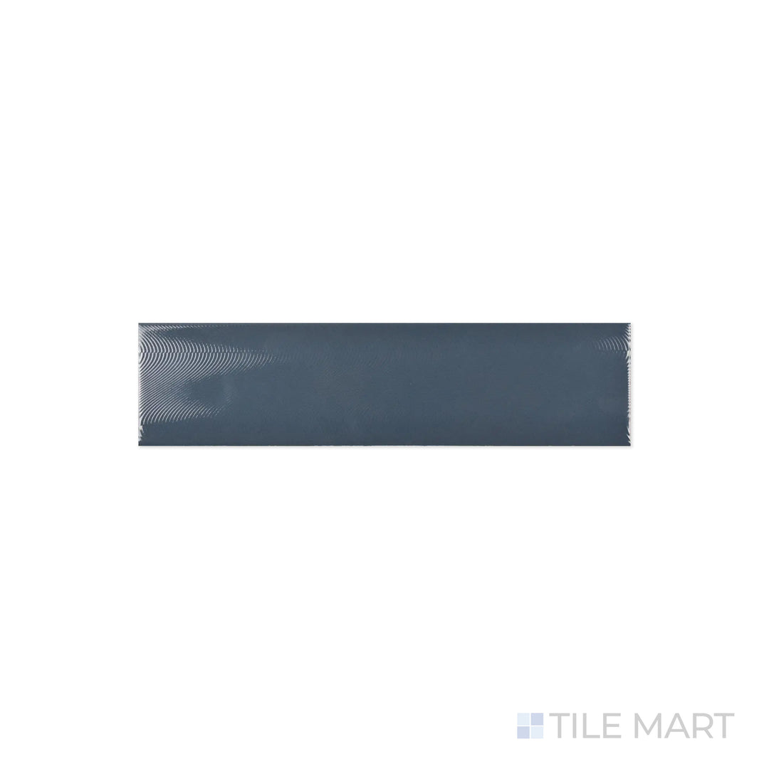 A detailed close-up of Cc Cosmos Petrol 3X12 Bright Ceramic reveals its deep petrol blue tone with a reflective glaze, perfect for creating a bold accent.