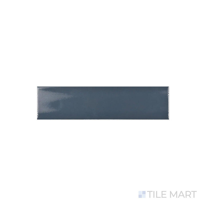 A detailed close-up of Cc Cosmos Petrol 3X12 Bright Ceramic reveals its deep petrol blue tone with a reflective glaze, perfect for creating a bold accent.