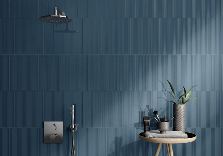 Make a bold statement with CC Cosmos Petrol 3X12 bright ceramic tile, where deep blue-green hues create an atmosphere of depth, sophistication, and effortless style.